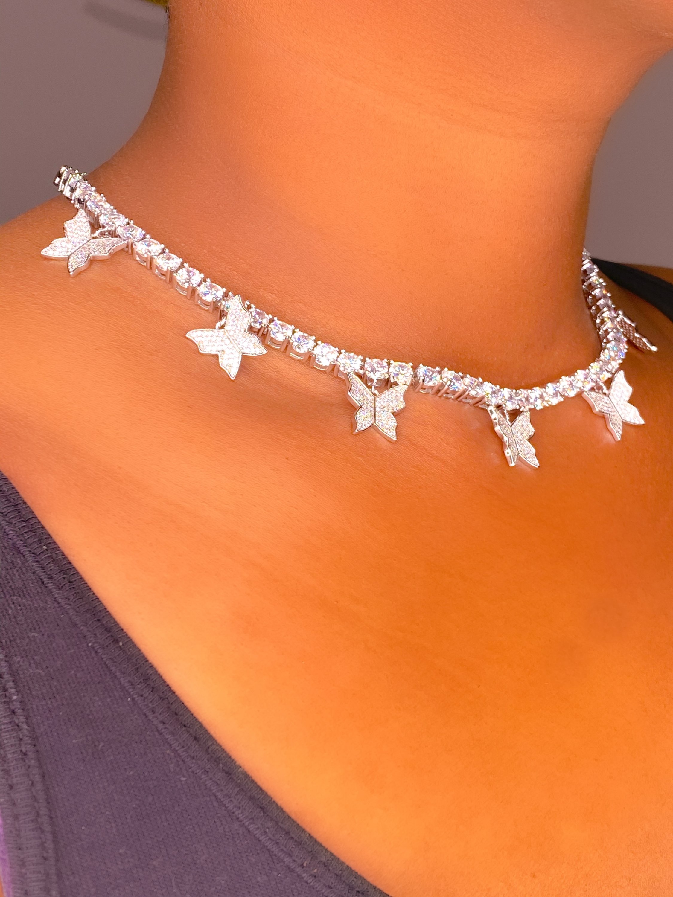 So Icy Butterfly Choker made of high polished 14K white gold with flawless VVS simulants, featuring a unique butterfly design.