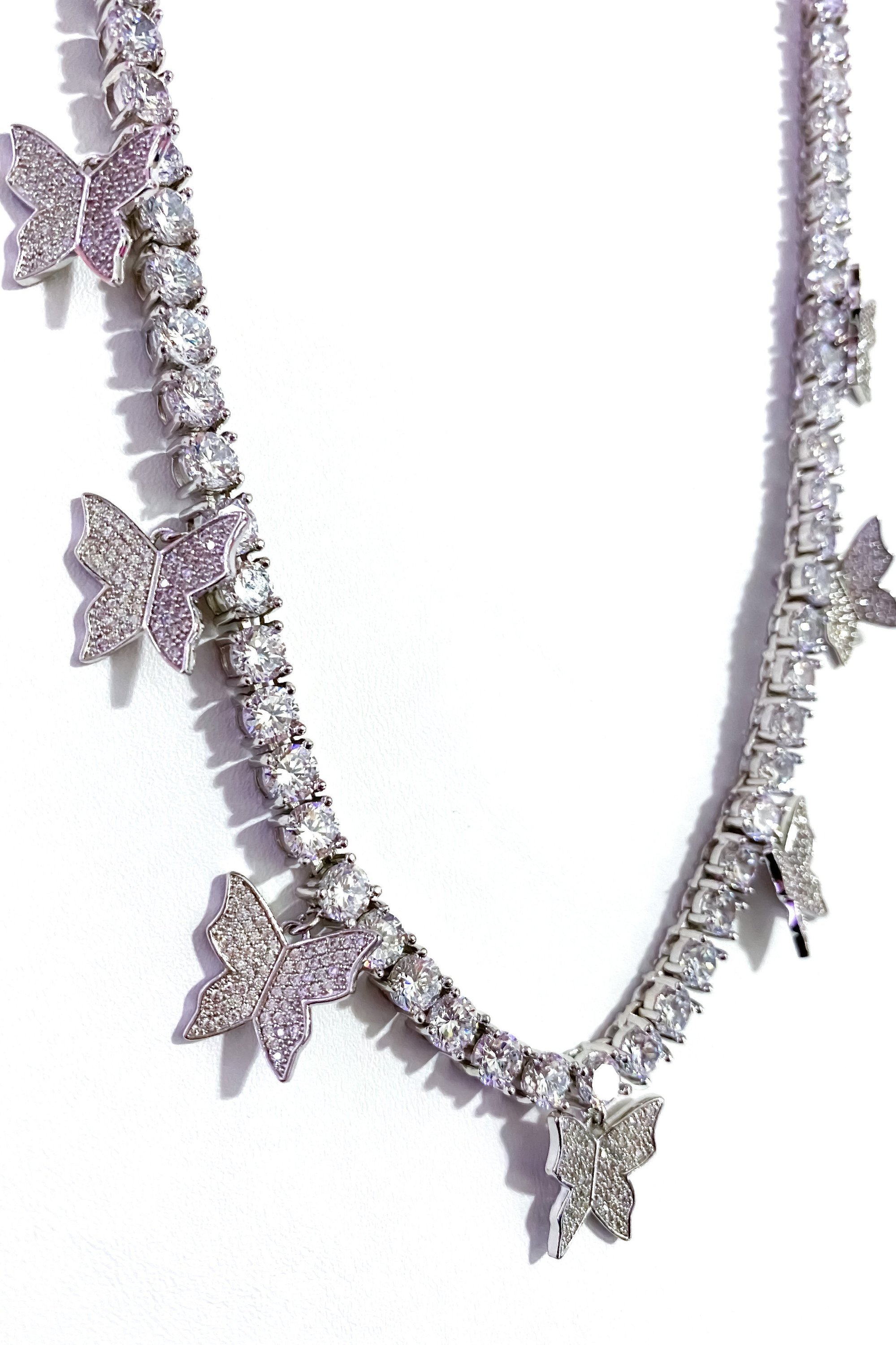 So Icy Butterfly Choker made of high polished 14K white gold with flawless VVS simulants, featuring a unique butterfly design.