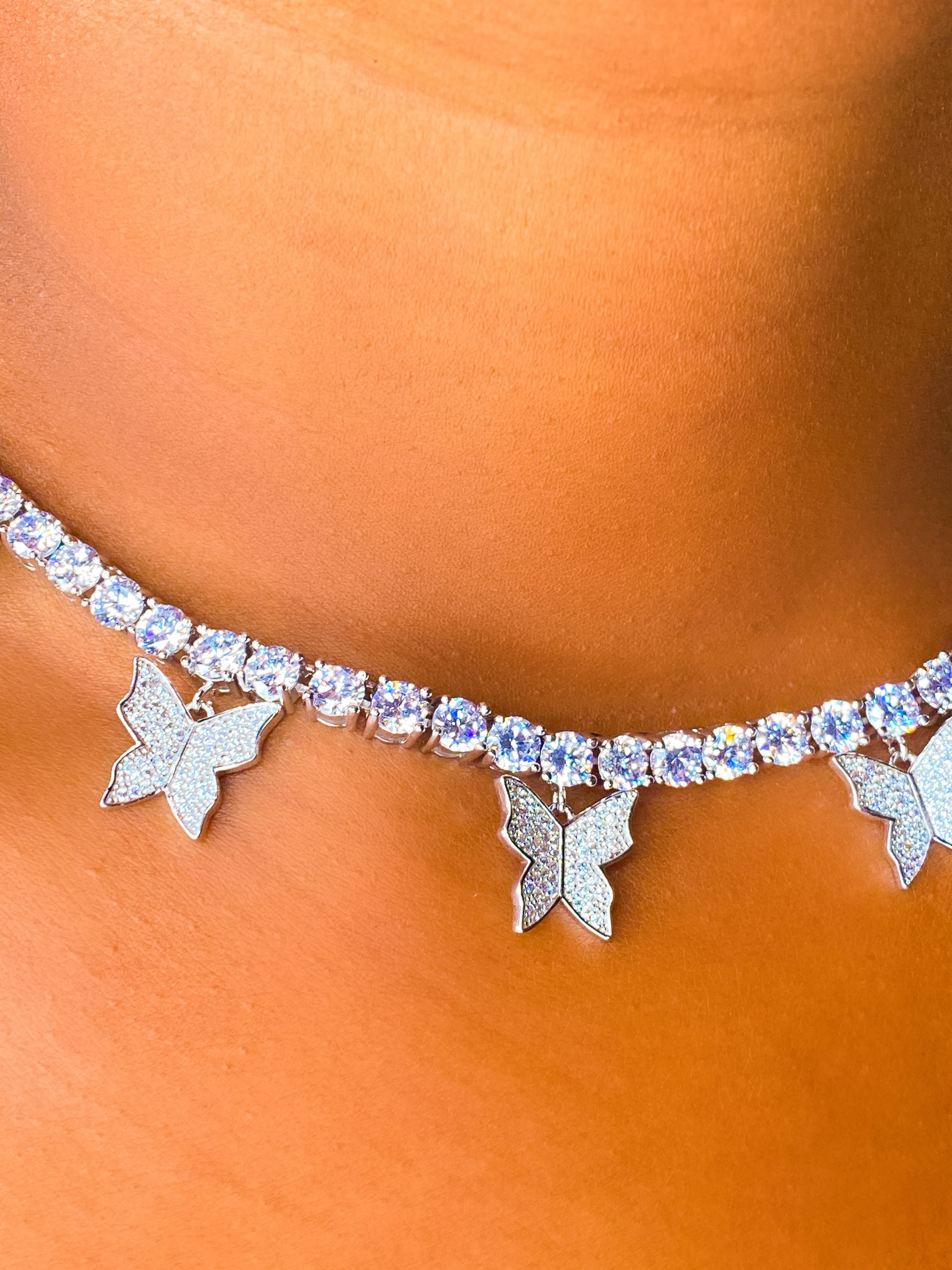 So Icy Butterfly Choker made of high polished 14K white gold with flawless VVS simulants, featuring a unique butterfly design.