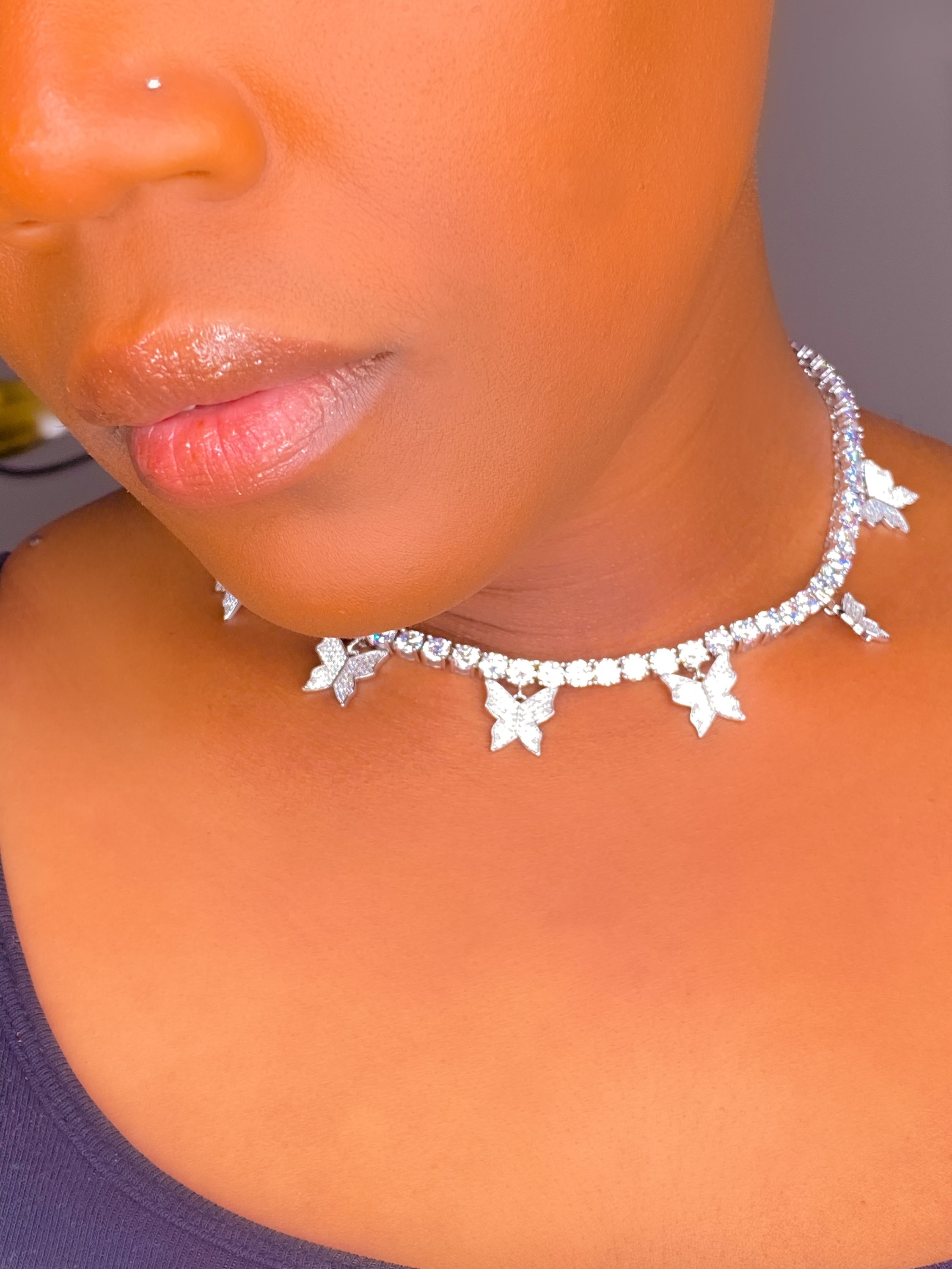 So Icy Butterfly Choker made of high polished 14K white gold with flawless VVS simulants, featuring a unique butterfly design.