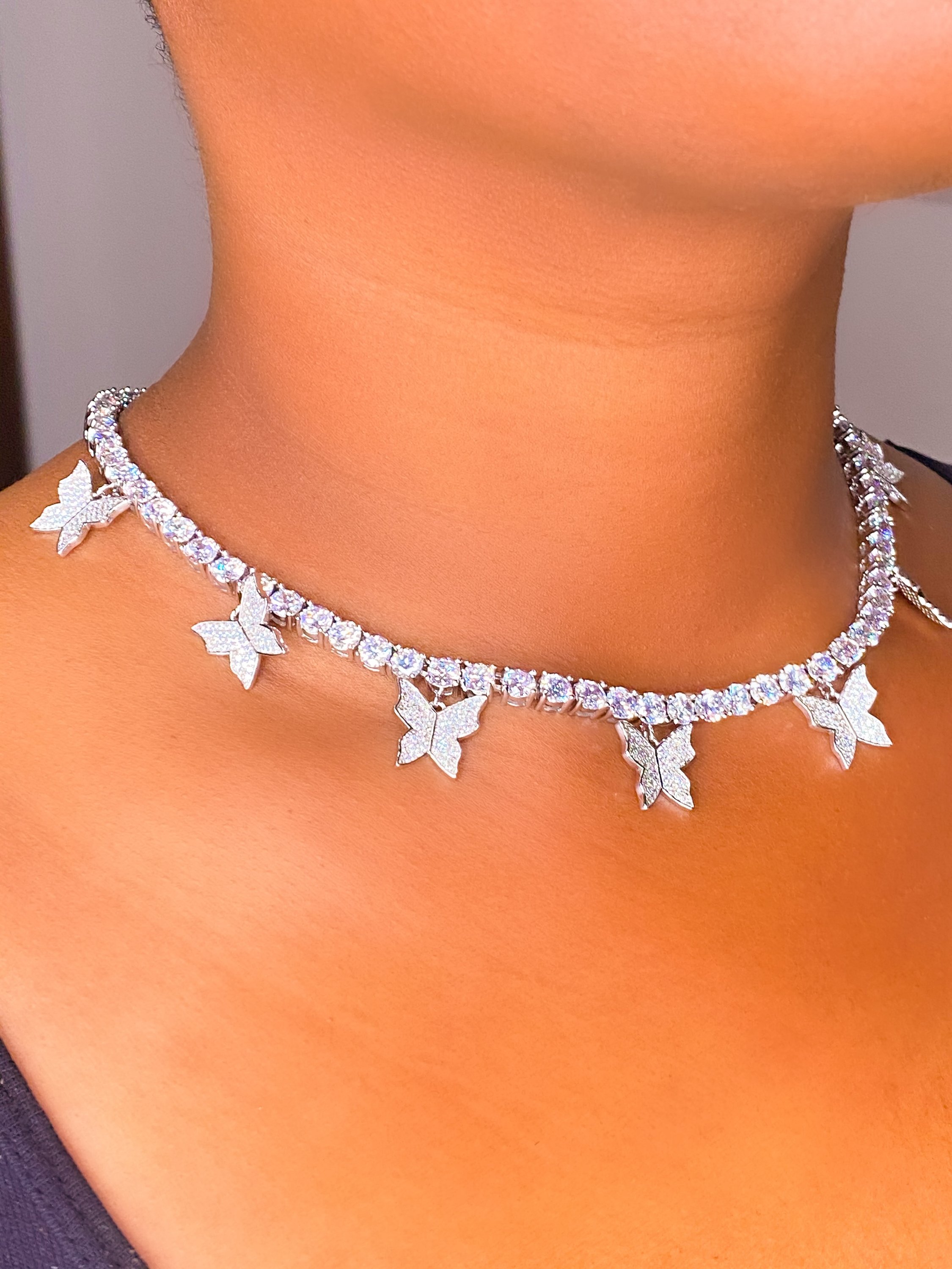 So Icy Butterfly Choker made of high polished 14K white gold with flawless VVS simulants, featuring a unique butterfly design.