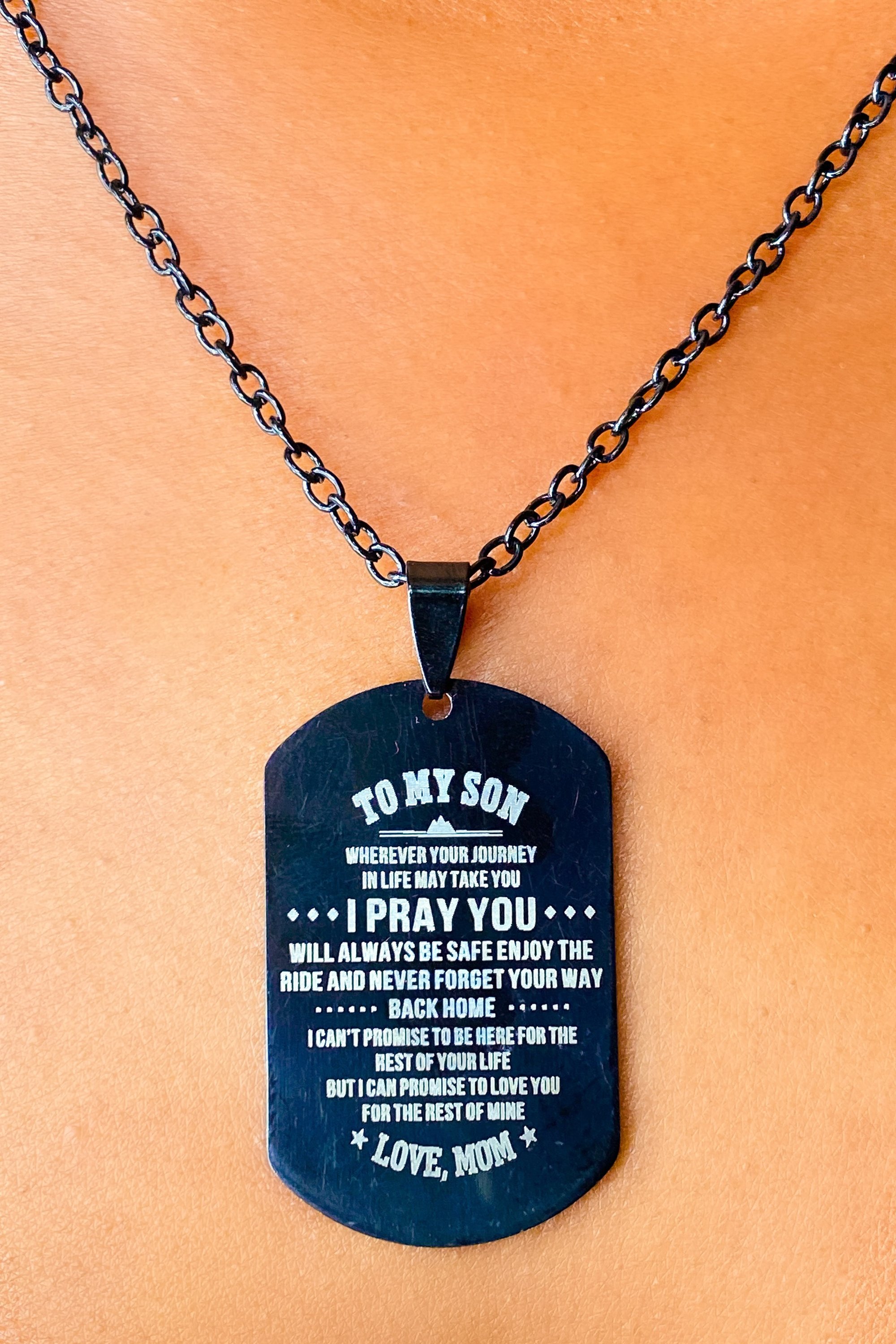 Black dog tag necklace message