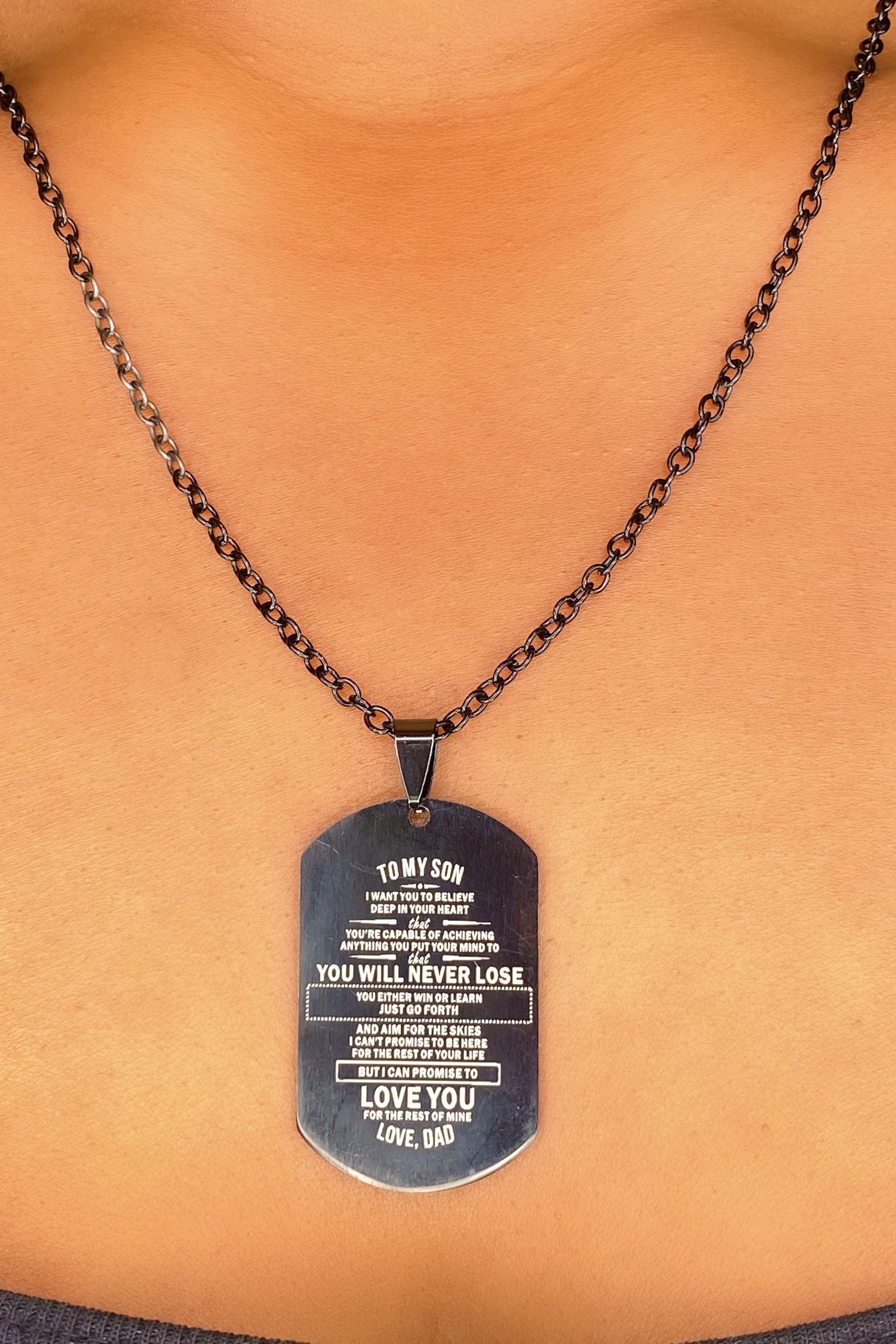 Dog tag necklace with message.