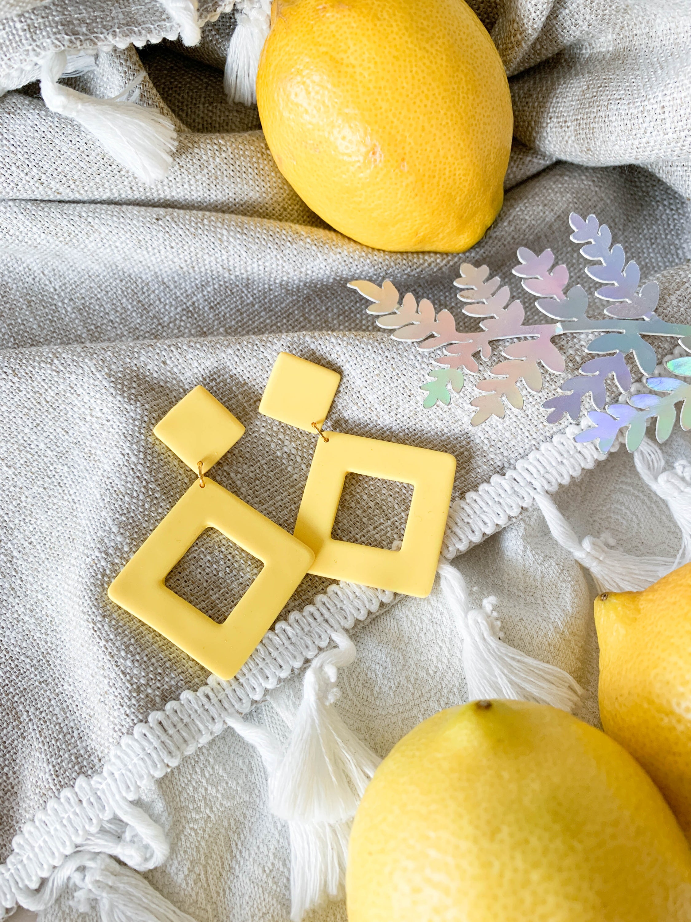 Nicole Lemon earrings featuring a vibrant lemon design with surgical steel posts for sensitive ears.