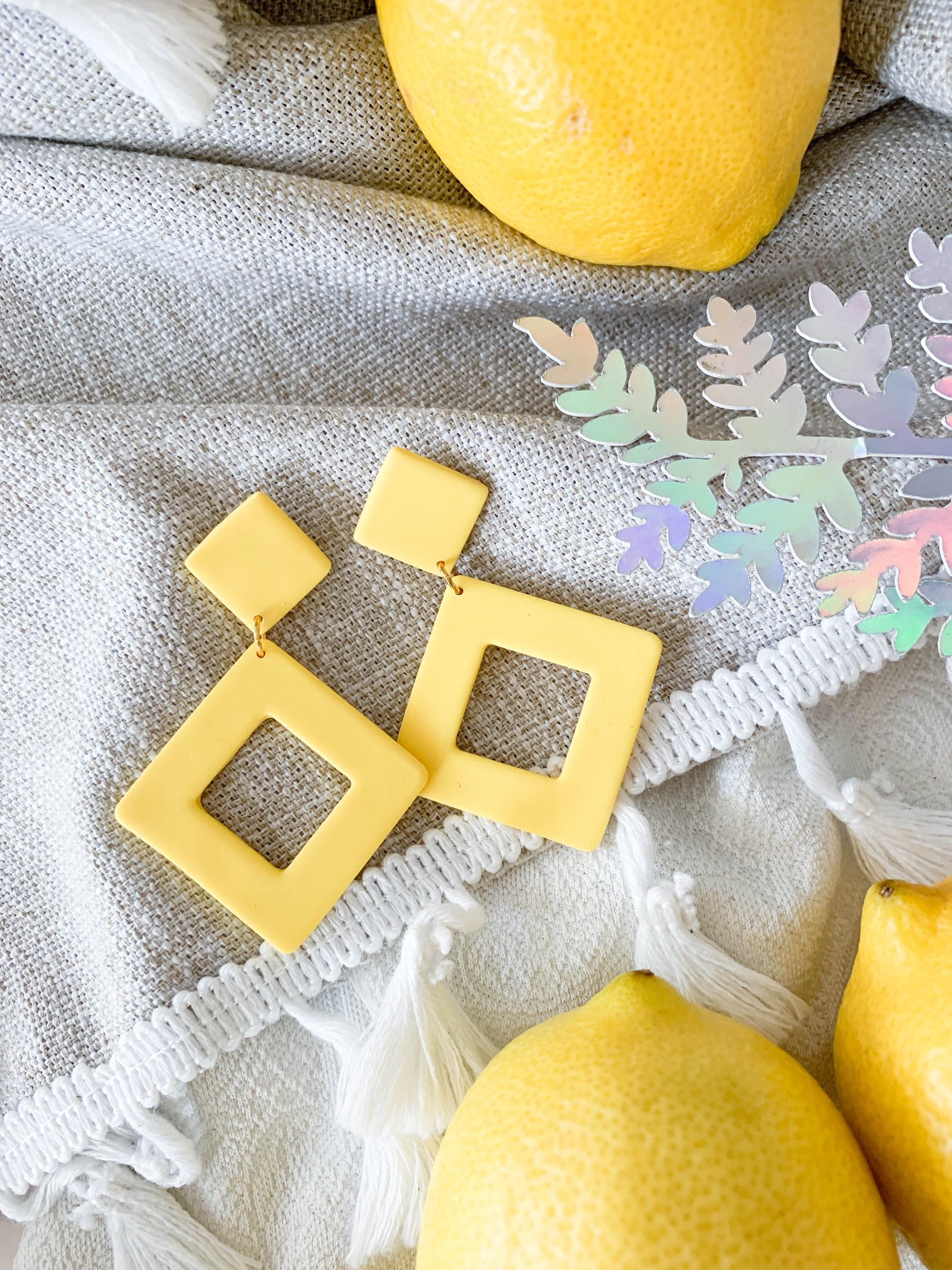 Nicole Lemon earrings featuring a vibrant lemon design with surgical steel posts for sensitive ears.