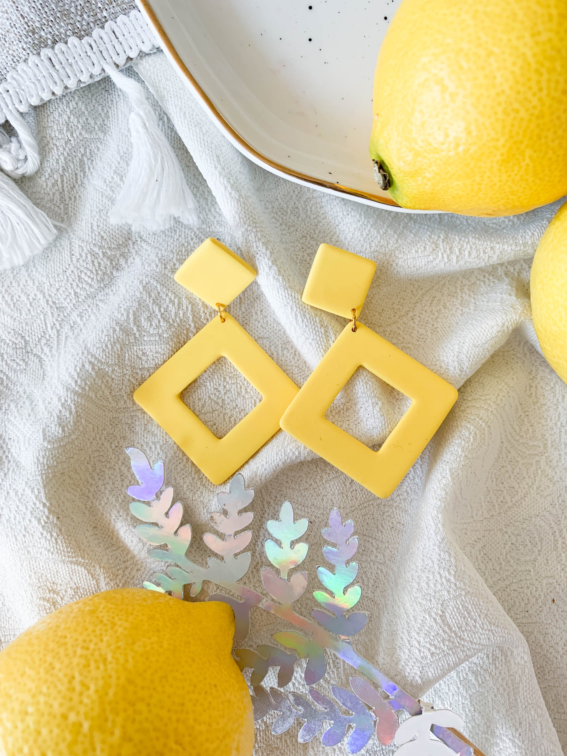 Nicole Lemon earrings featuring a vibrant lemon design with surgical steel posts for sensitive ears.