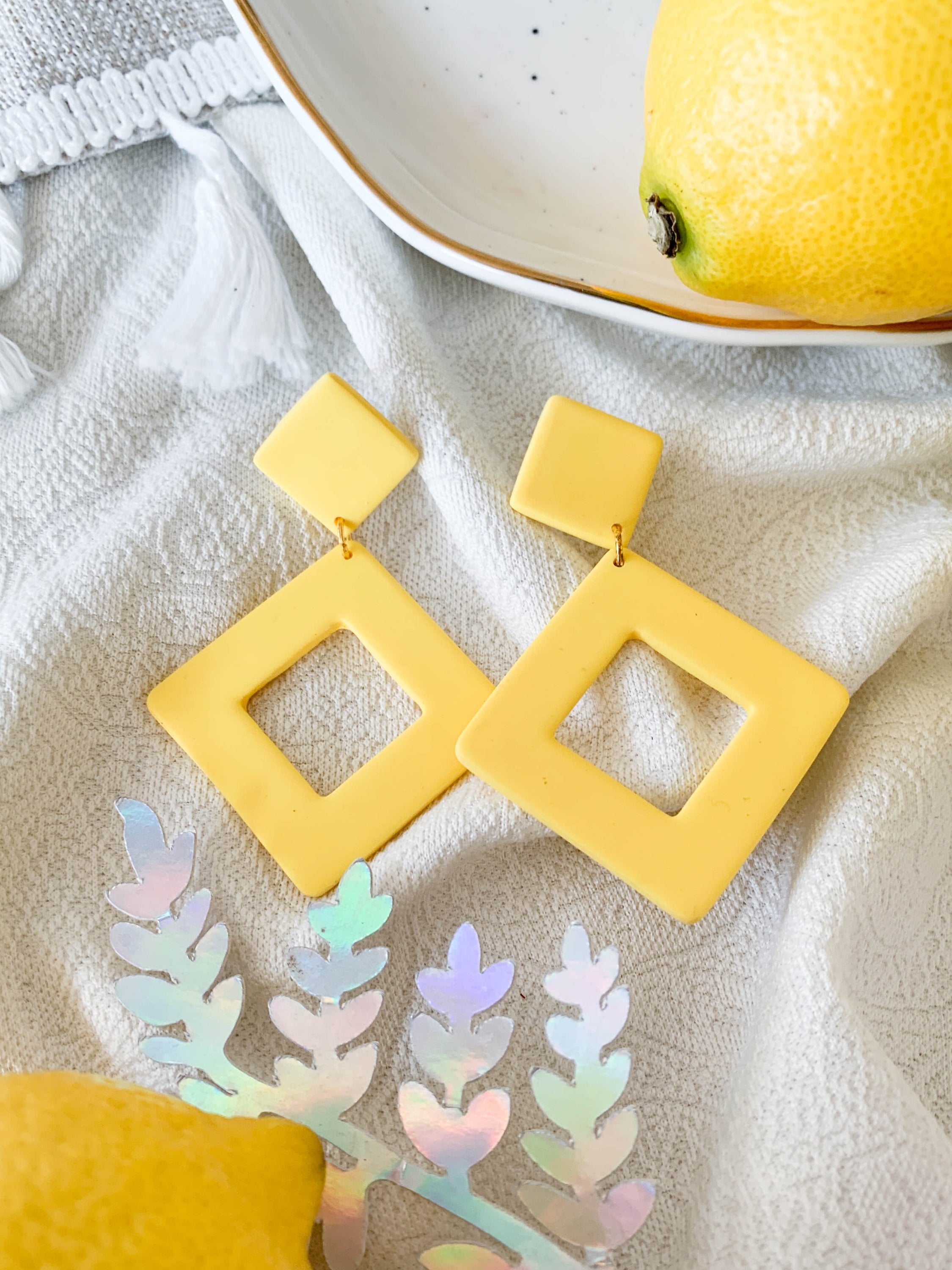 Nicole Lemon earrings featuring a vibrant lemon design with surgical steel posts for sensitive ears.