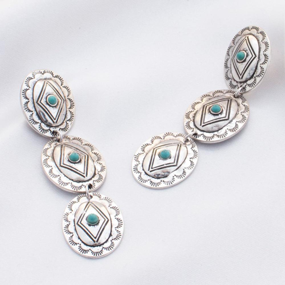 Oval Western Metal Dangle Earring featuring turquoise accents, showcasing a stylish and elegant design.