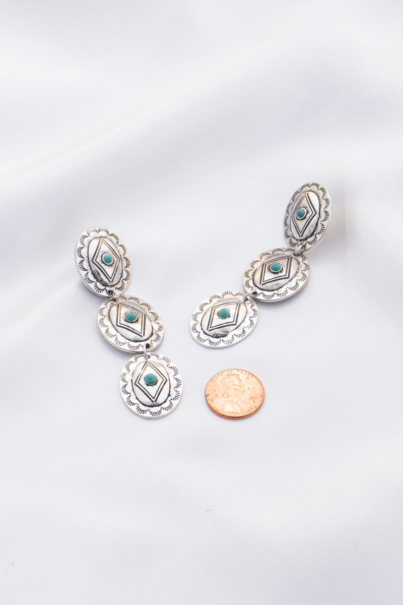 Oval Western Metal Dangle Earring featuring turquoise accents, showcasing a stylish and elegant design.