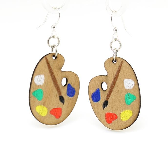 Colorful laser-cut wood earrings shaped like painter palettes, featuring hypoallergenic silver-finished ear wires.