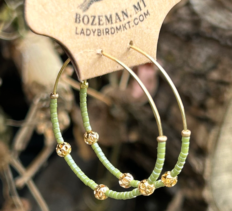 Pale green and gold beaded hoop earrings featuring Miyuki Delica seed beads and metallic gold lattice beads, elegantly designed for bohemian style.