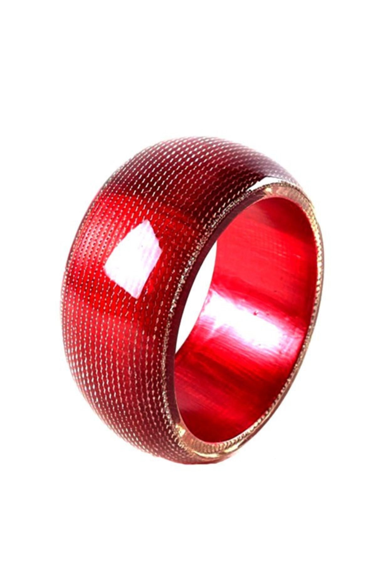 A colorful patterned plastic bangle with a 3-inch diameter, showcasing a stylish design suitable for various outfits.