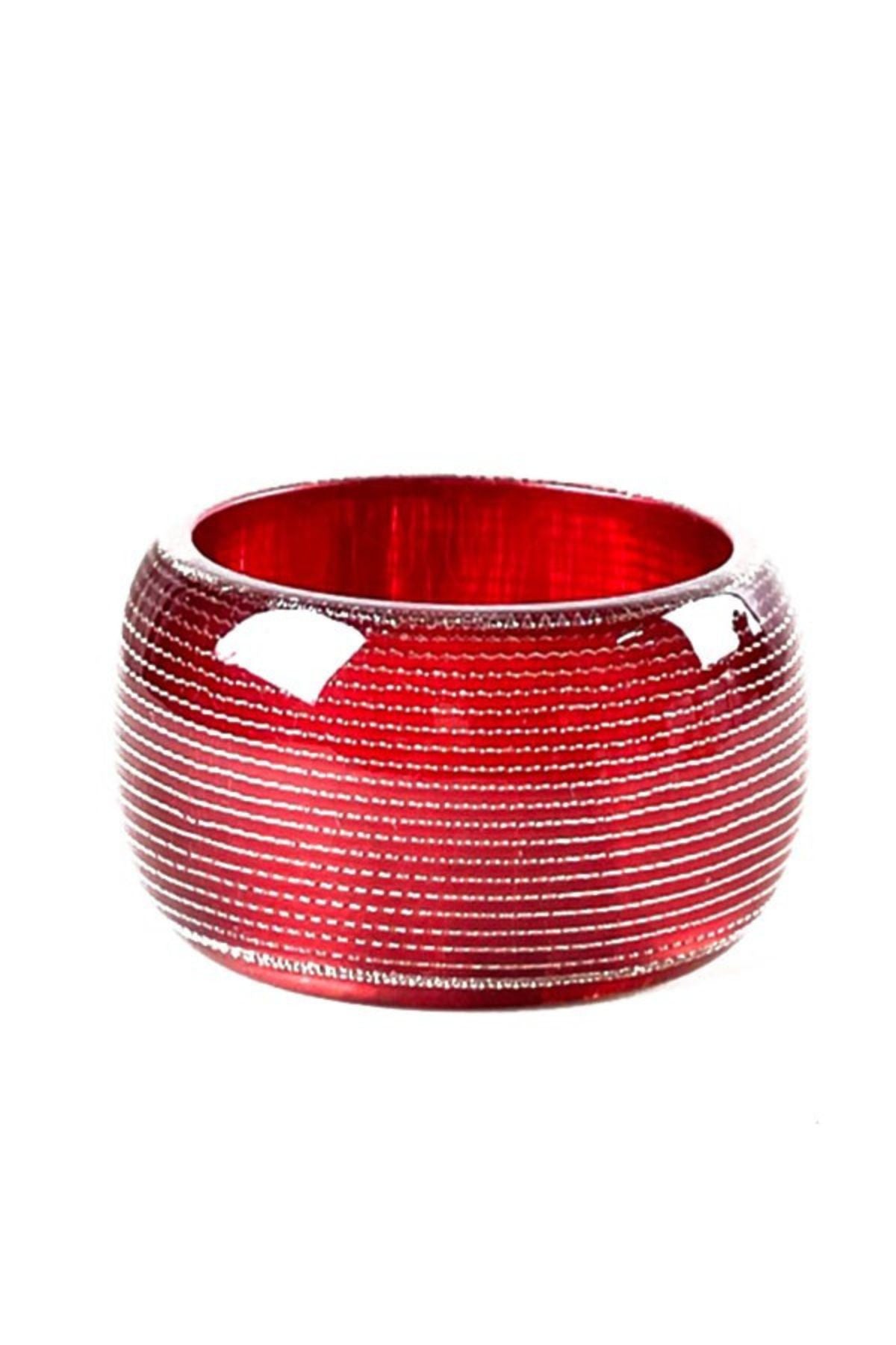 A colorful patterned plastic bangle with a 3-inch diameter, showcasing a stylish design suitable for various outfits.