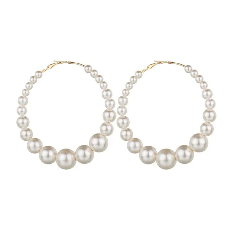 Trendy Pearl Girl Glam hoop earrings featuring pearl-like beads and gold accents, perfect for stylish accessorizing.