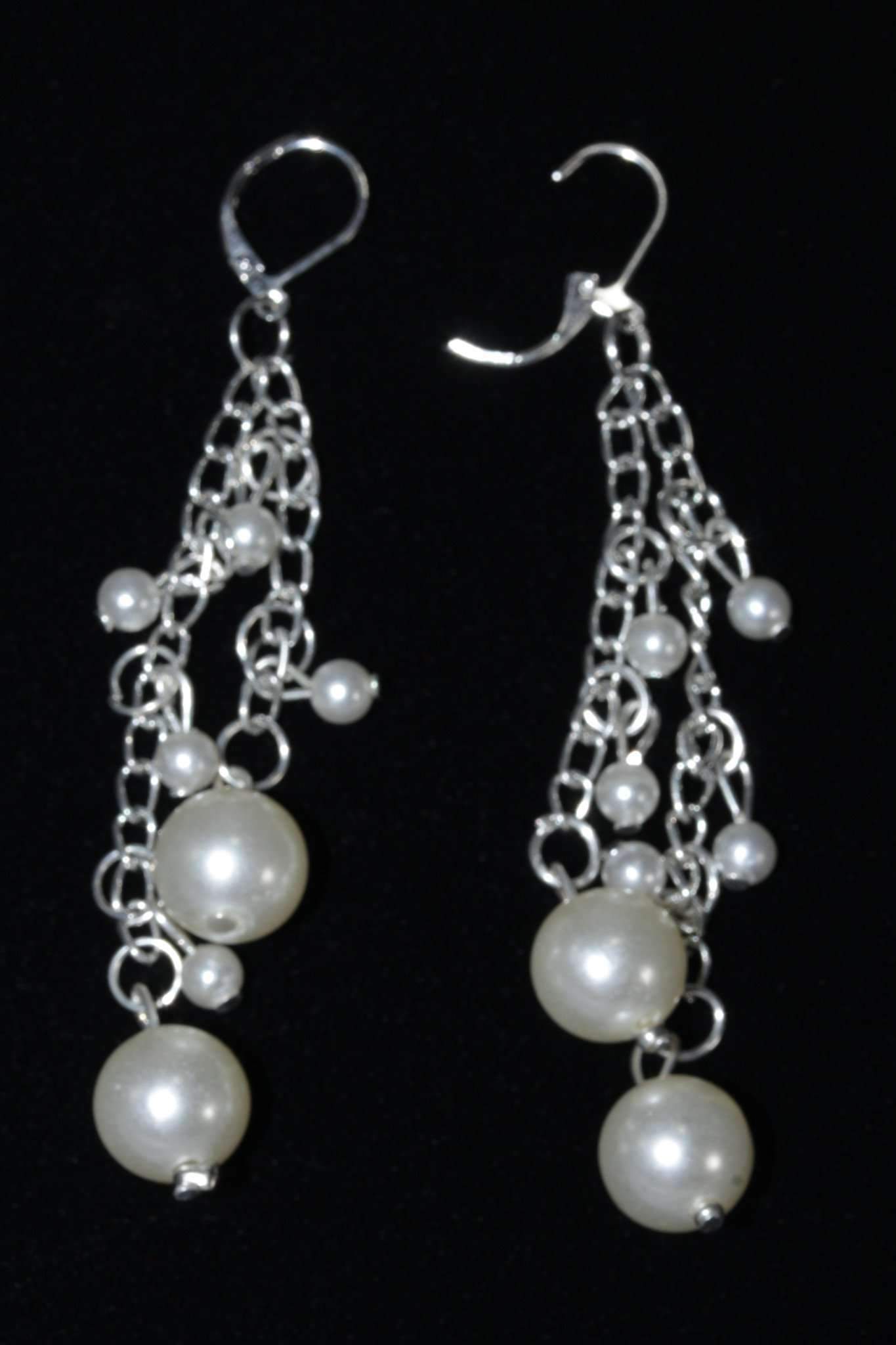 Elegant silvertone dangle earrings featuring faux pearls, perfect for bridesmaids and special occasions.