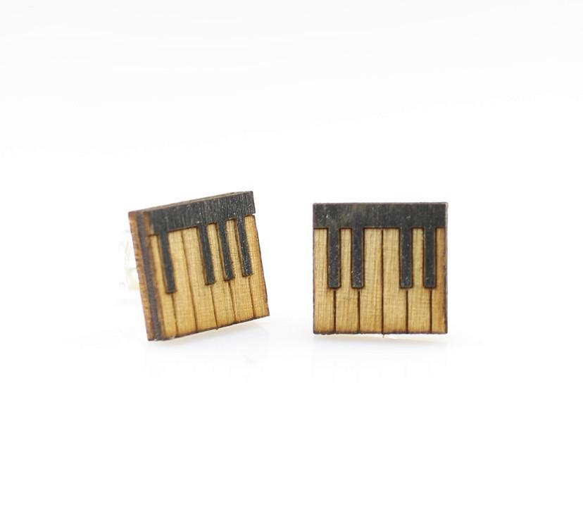 A pair of Piano Key Stud Earrings made from sustainably sourced wood, featuring a unique piano key design, lightweight and hypoallergenic.