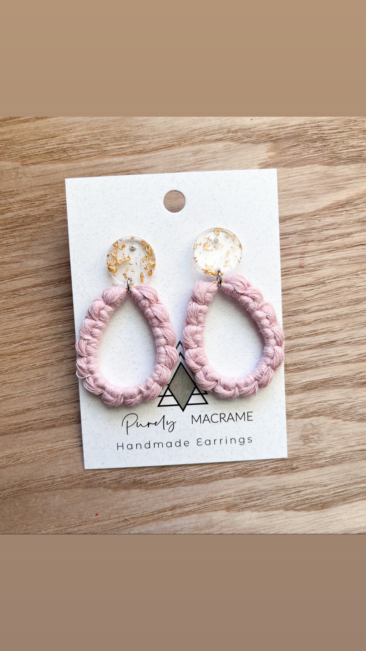 A pair of lightweight Pink Gems made from 100% macrame cotton, showcasing their elegant design and soft texture.