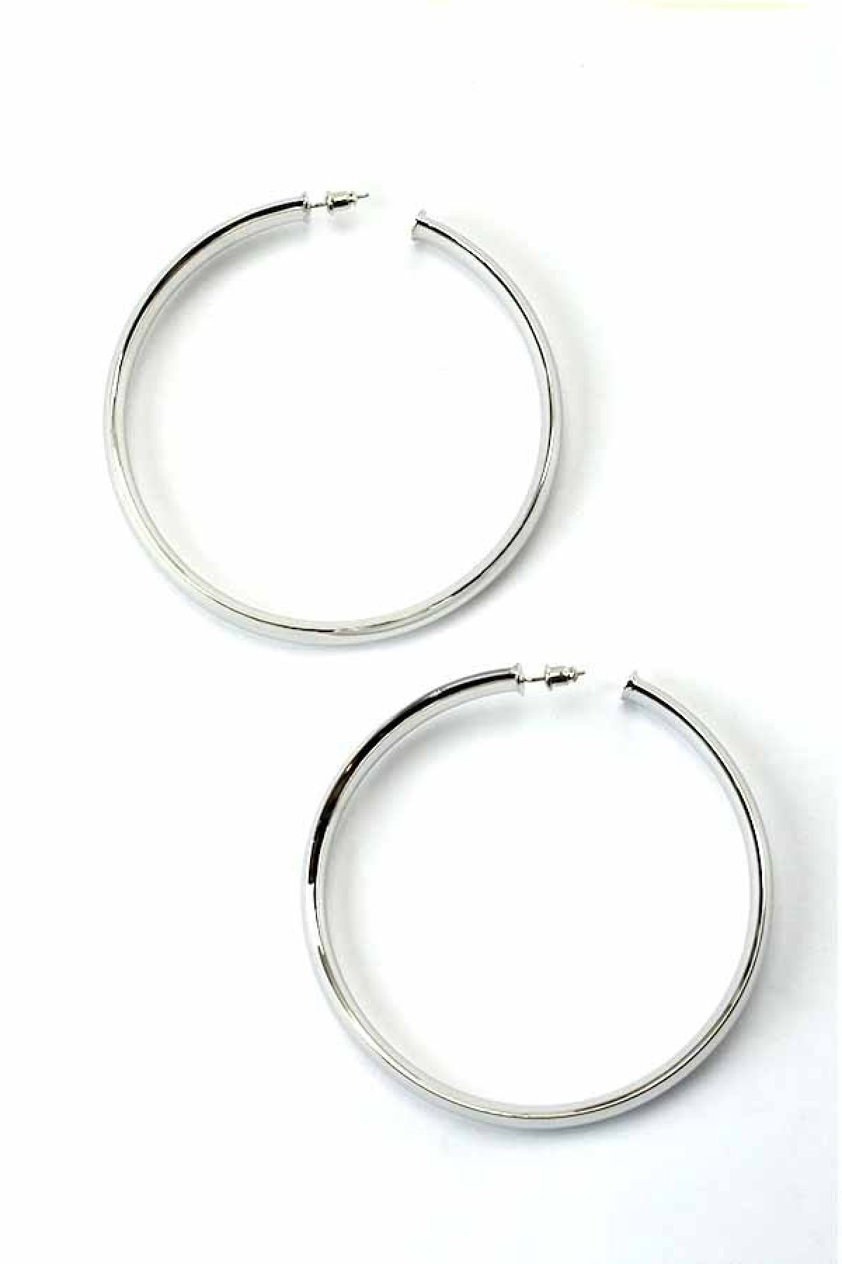 A pair of elegant plain thick hoop earrings with a 4-inch diameter, showcasing a shiny finish and secure post back closure.