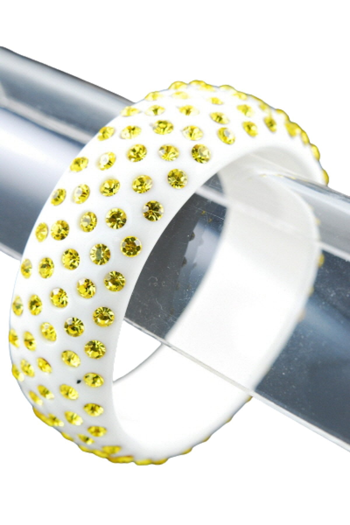 A stylish plastic stone bangle with a 3-inch diameter and 1-inch width, showcasing its elegant design.