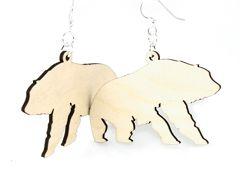 A pair of elegant Polar Bear Earrings made from sustainably sourced wood, featuring intricate laser-cut designs and silver-finished hypoallergenic ear wires.