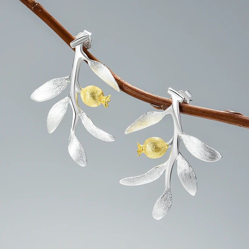 Elegant Pomegranate Branch Earrings featuring a silver leaf design with 18K gold plating and a natural pearl accent.