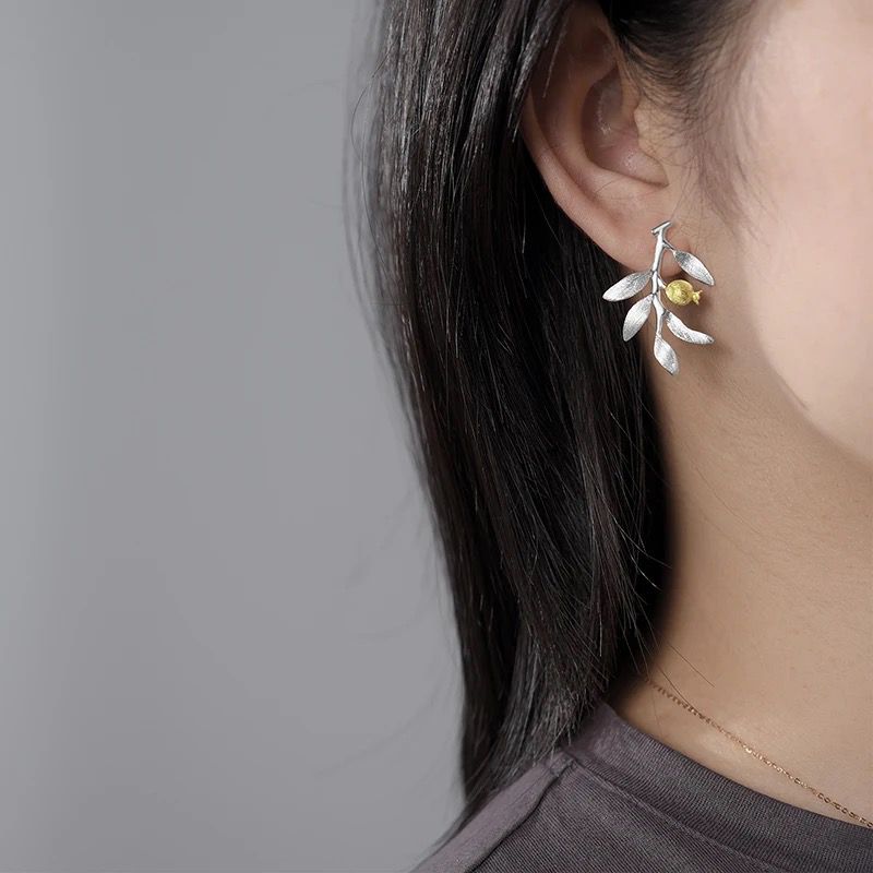 Elegant Pomegranate Branch Earrings featuring a silver leaf design with 18K gold plating and a natural pearl accent.