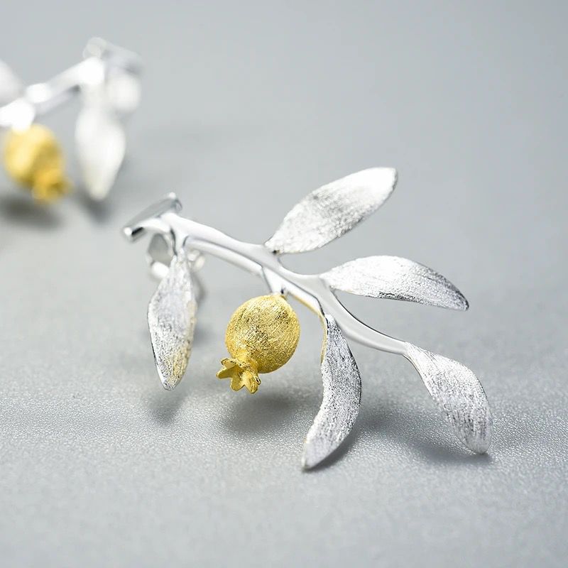 Elegant Pomegranate Branch Earrings featuring a silver leaf design with 18K gold plating and a natural pearl accent.