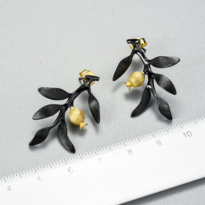 Elegant Pomegranate Branch Earrings featuring a silver leaf design with 18K gold plating and a natural pearl accent.