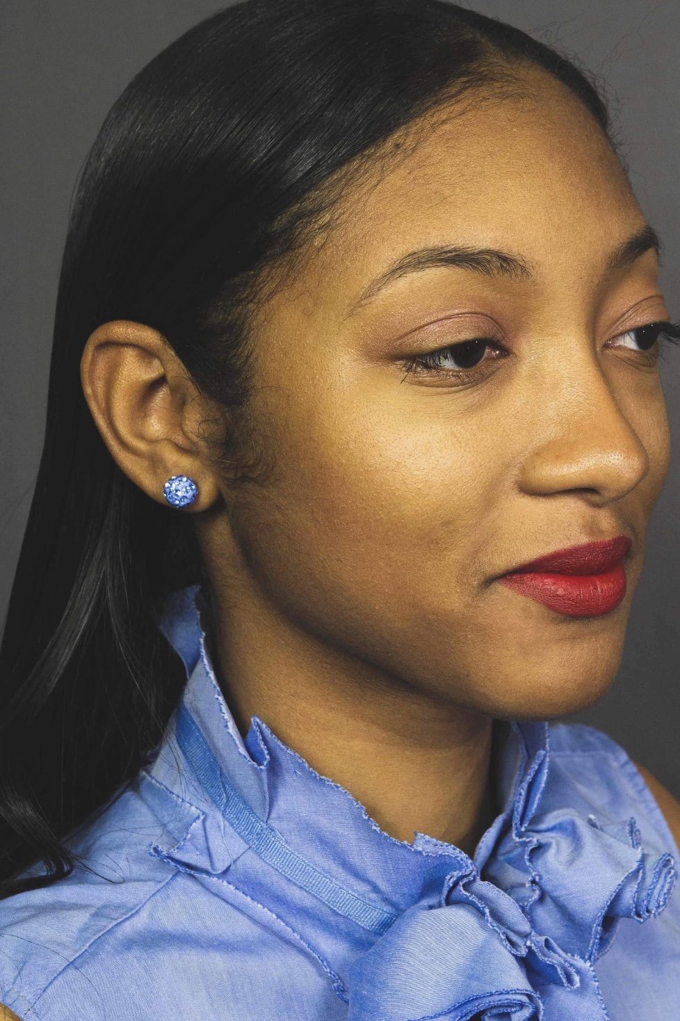 A pair of round ceramic stud earrings with a sparkling finish, featuring a nickel-free brass back finding, perfect for casual wear.