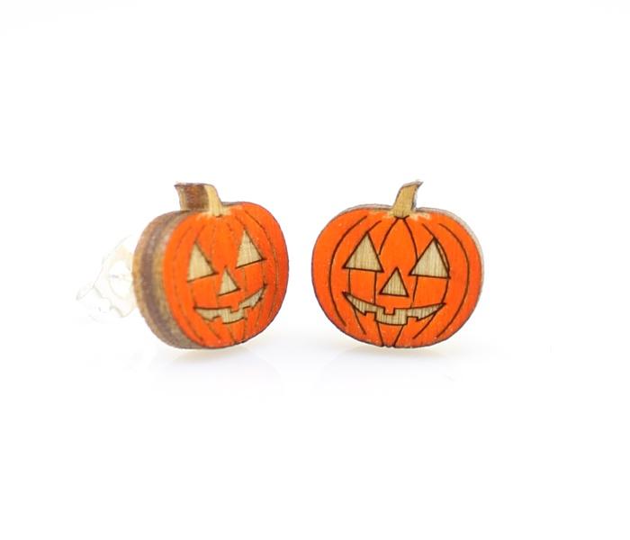 A pair of lightweight pumpkin stud earrings made from sustainably sourced wood, featuring intricate laser-cut designs and silver plated brass ear studs.