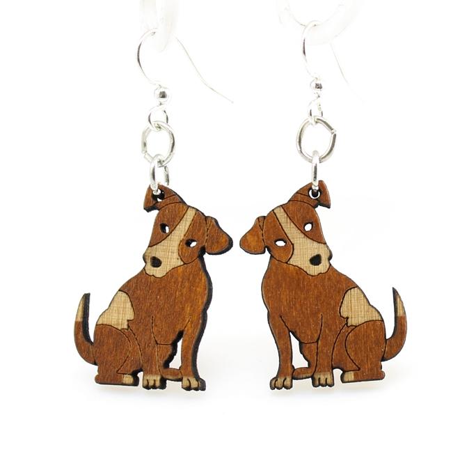 A pair of laser-cut wooden puppy earrings in cinnamon color, featuring hypoallergenic silver-finished ear wires.