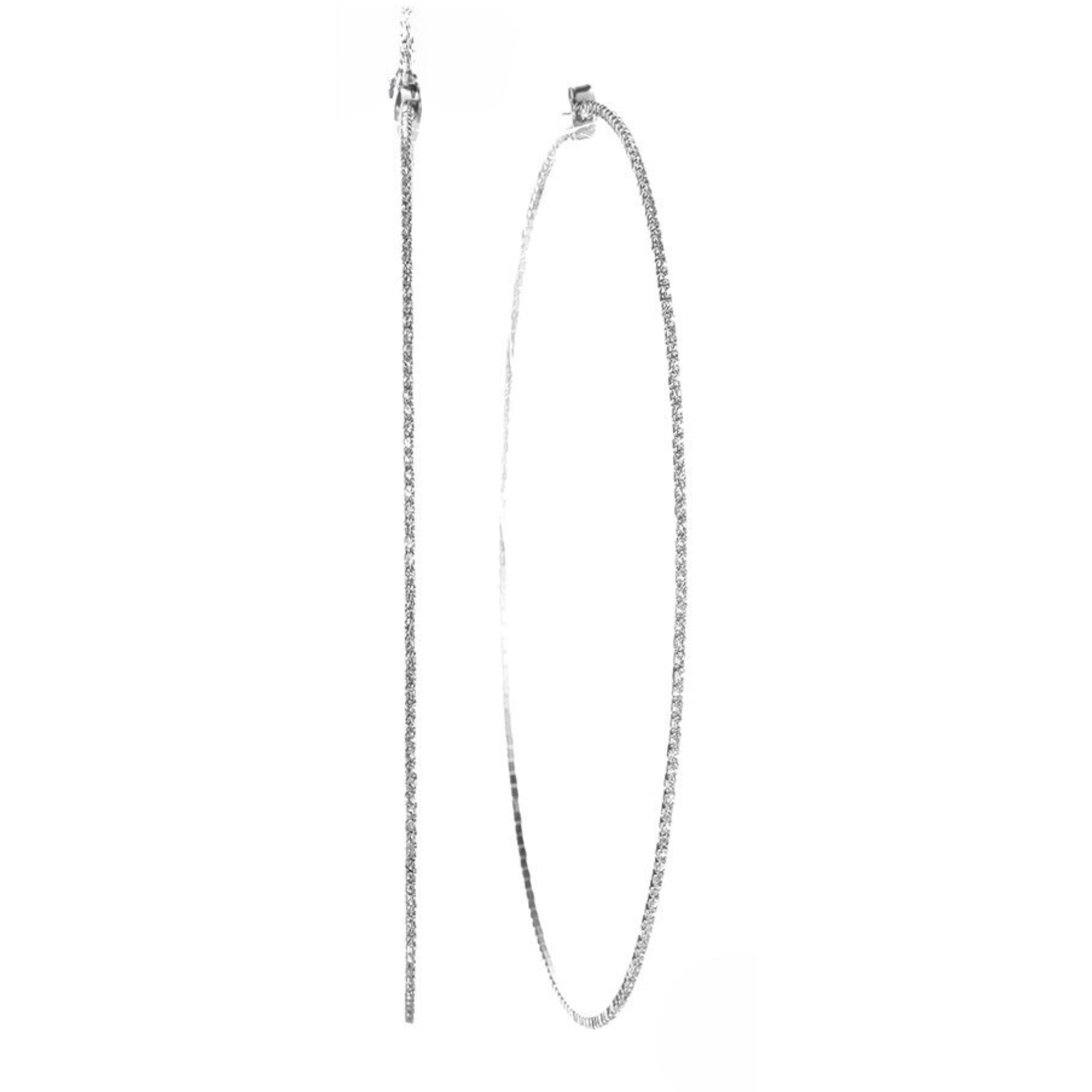 A pair of elegant Rhinestone 1.5 mm Crystal Wire Hoop Earrings showcasing sparkling rhinestones on a delicate wire hoop.