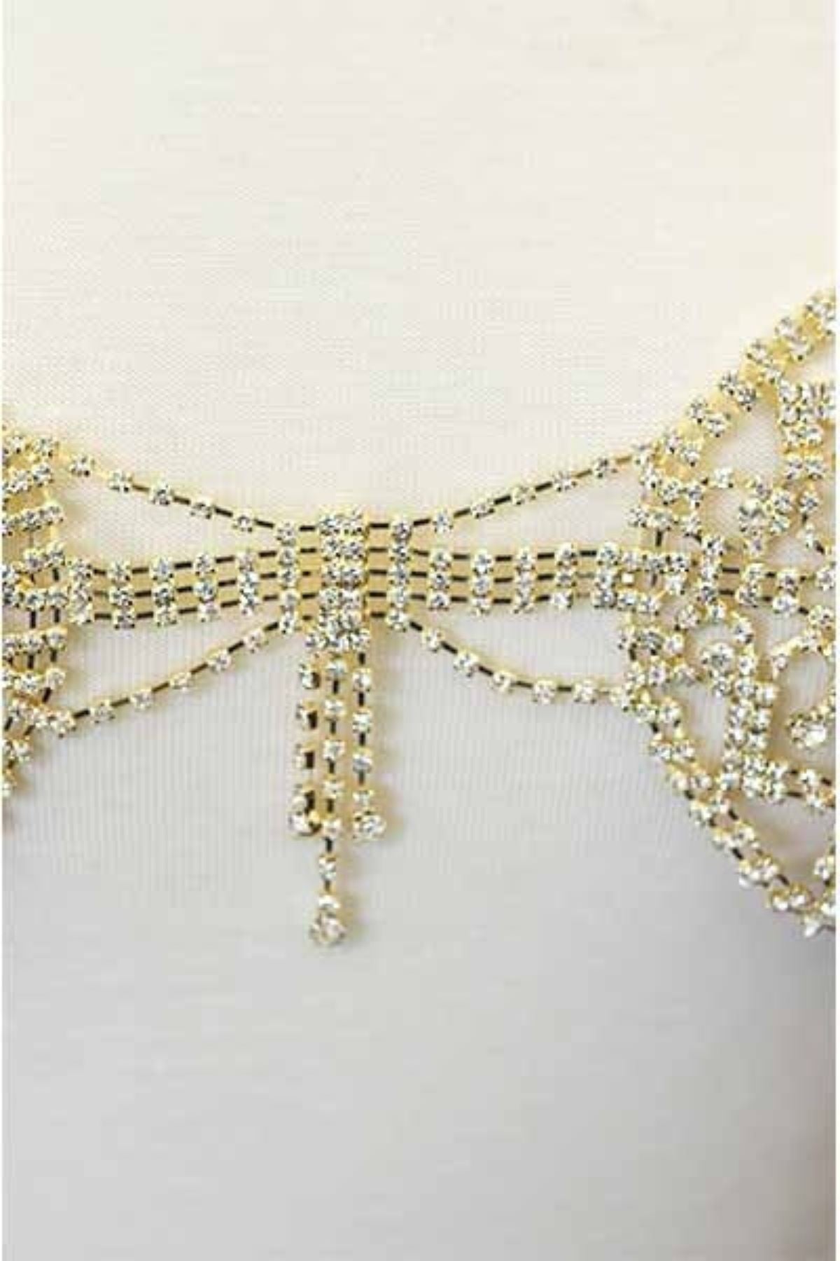 A glamorous Rhinestone Chain Bralette featuring sparkling rhinestones and a lobster claw clasp, perfect for stylish layering.