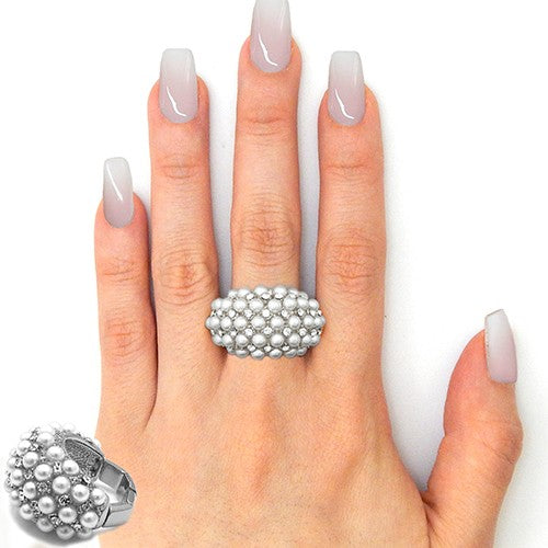 Elegant stretchable cocktail ring featuring pearls and rhinestones, perfect for special occasions.