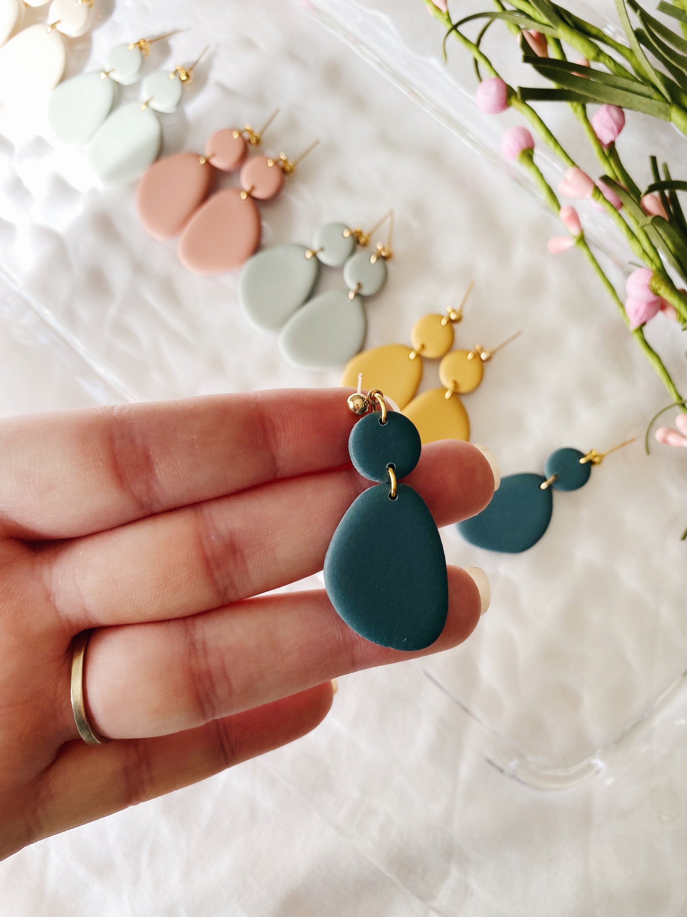 A pair of handcrafted minimalist statement earrings from the Selma Spring Fling Palette, showcasing unique designs and vibrant colors.