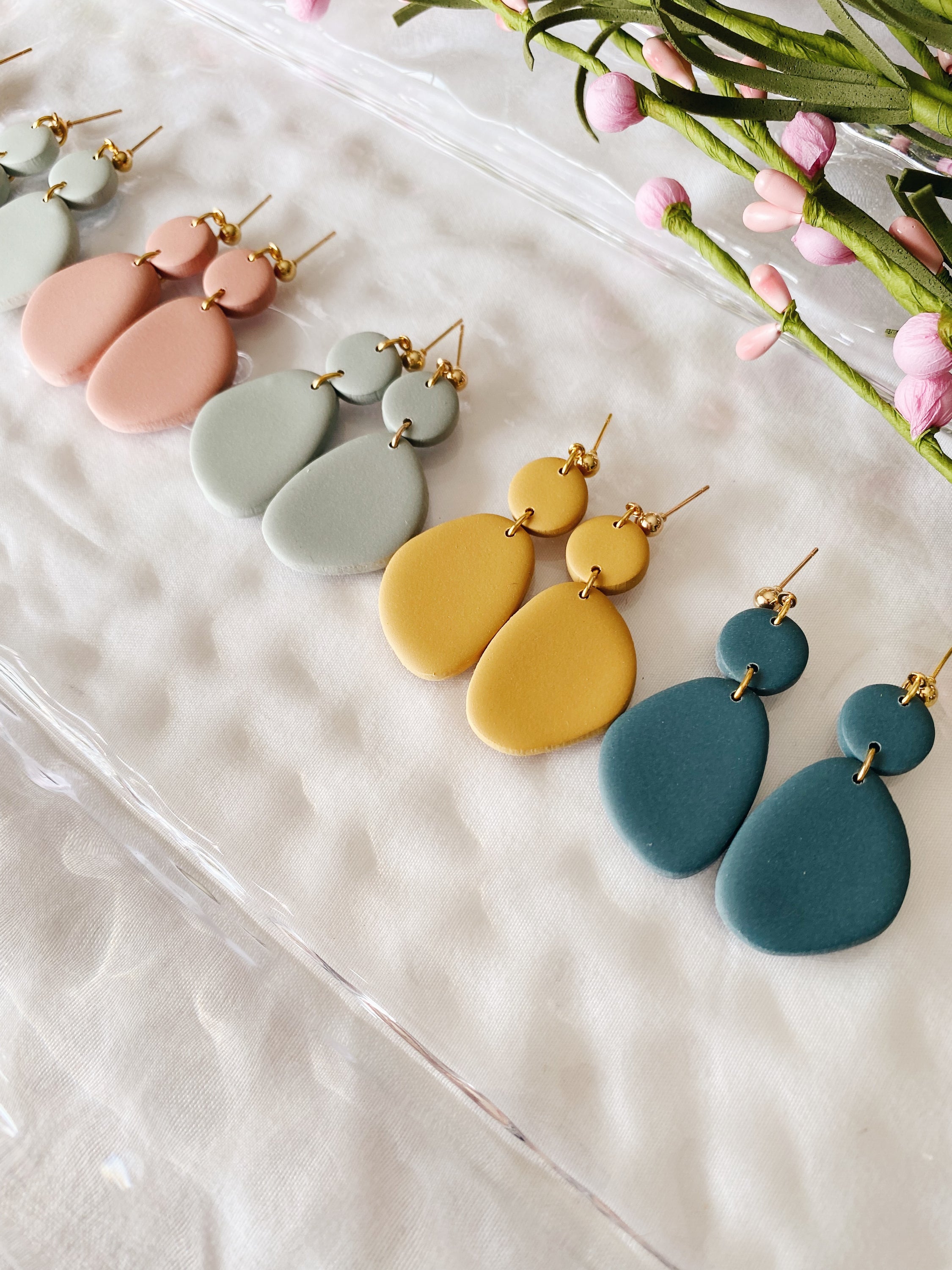 A pair of handcrafted minimalist statement earrings from the Selma Spring Fling Palette, showcasing unique designs and vibrant colors.