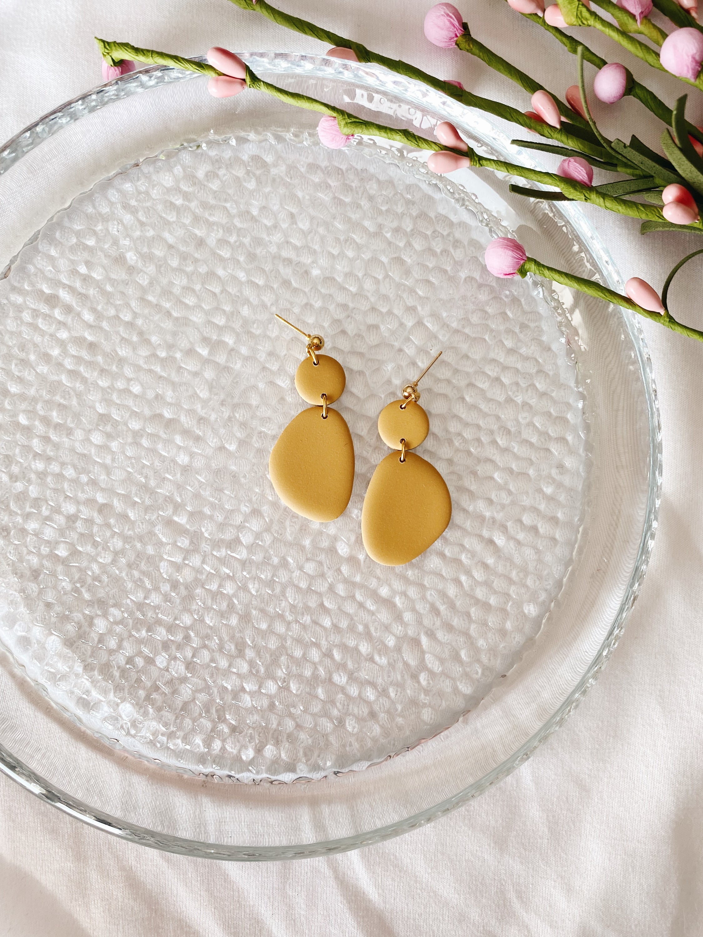 A pair of handcrafted minimalist statement earrings from the Selma Spring Fling Palette, showcasing unique designs and vibrant colors.