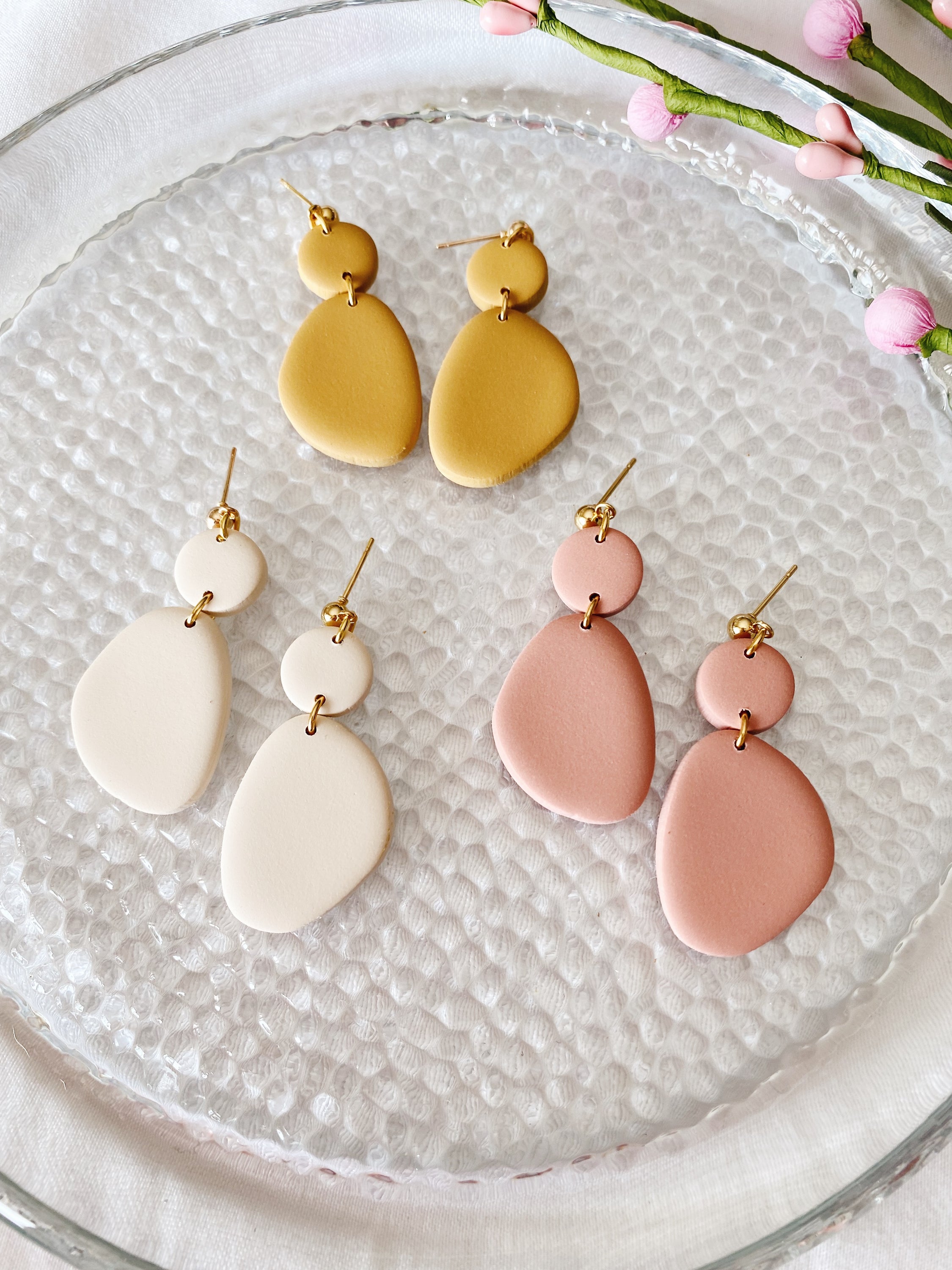 A pair of handcrafted minimalist statement earrings from the Selma Spring Fling Palette, showcasing unique designs and vibrant colors.