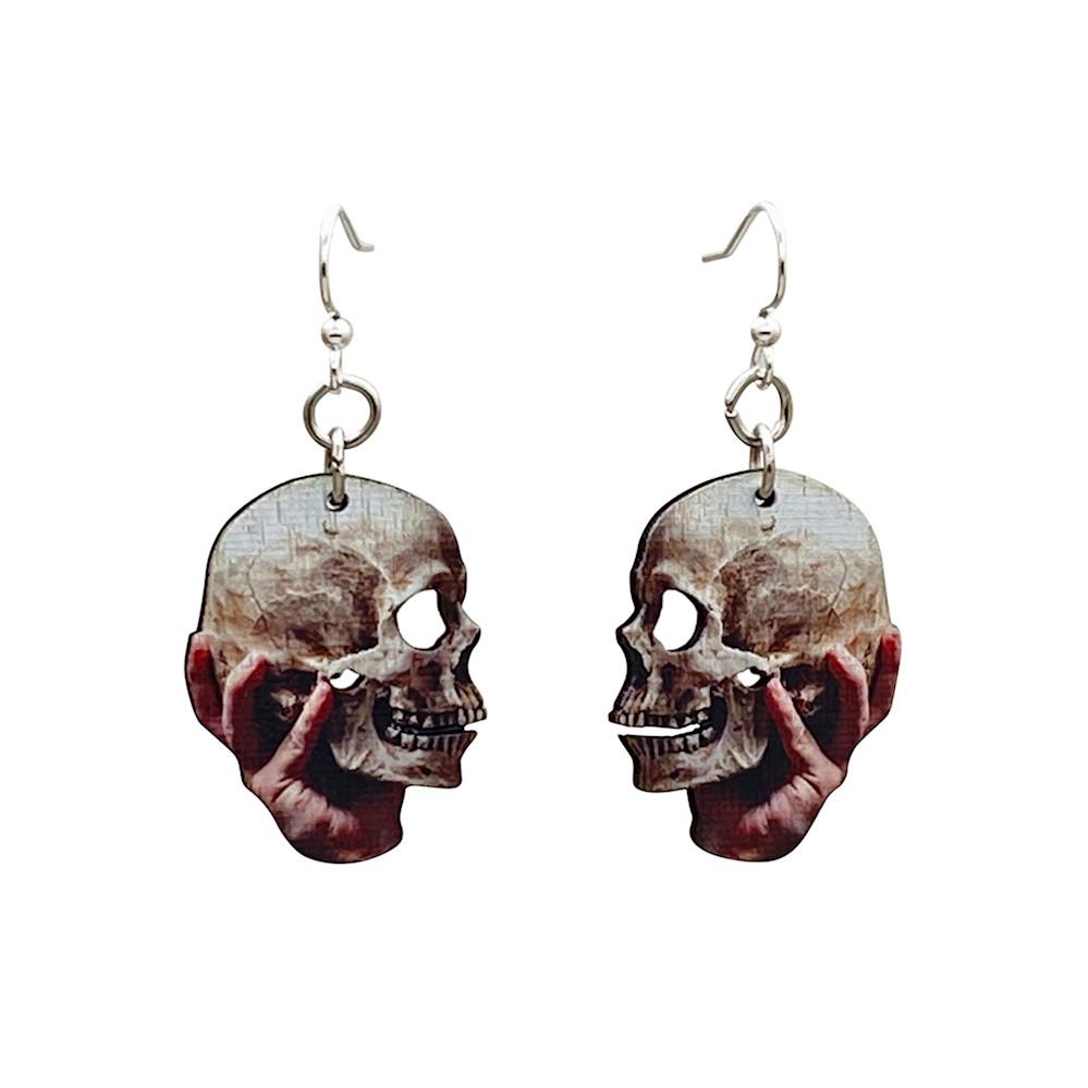 A pair of Skull and Hand Earrings made from sustainably sourced wood, featuring a laser-cut design and silver-finished stainless steel ear wires.