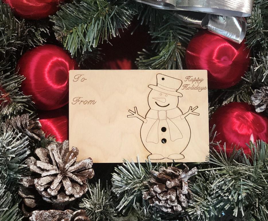 Snowman Holiday Ornament Card #9003 made from sustainably sourced wood, featuring a laser-cut design and a rustic finish, perfect for Christmas gifting.