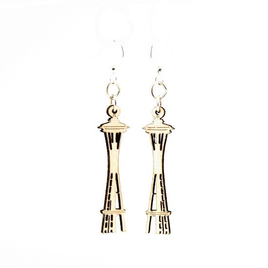 A pair of laser-cut wooden earrings shaped like the Space Needle, featuring silver-finished hypoallergenic ear wires.