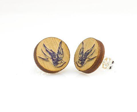 A pair of Sparrow Stud Earrings featuring a charming sparrow design, made from lightweight laser-cut wood with a silver plated brass earstud.