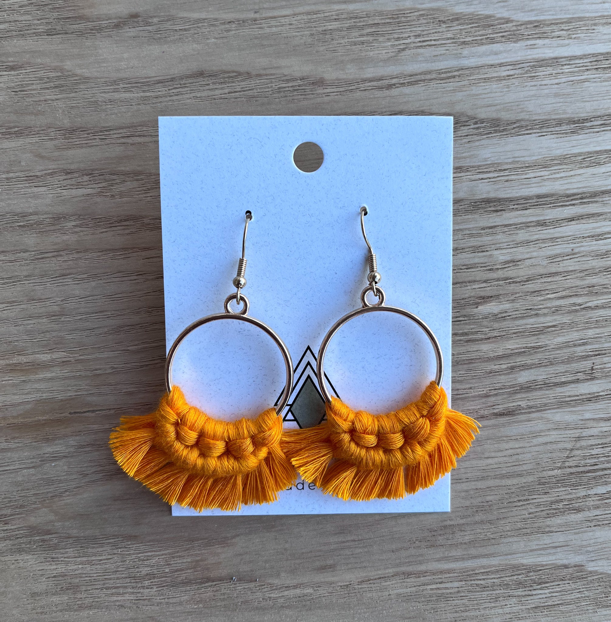 A pair of vibrant Spring Orange Rounds made from 100% cotton, showcasing their lightweight and breathable design.