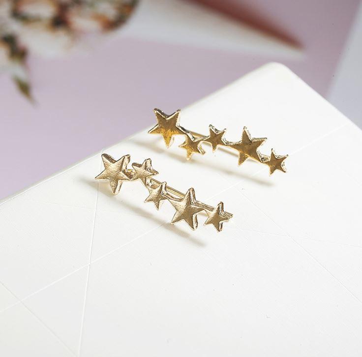 A pair of elegant Star Ear Crawlers made from high-quality zinc alloy, featuring a stylish star design.