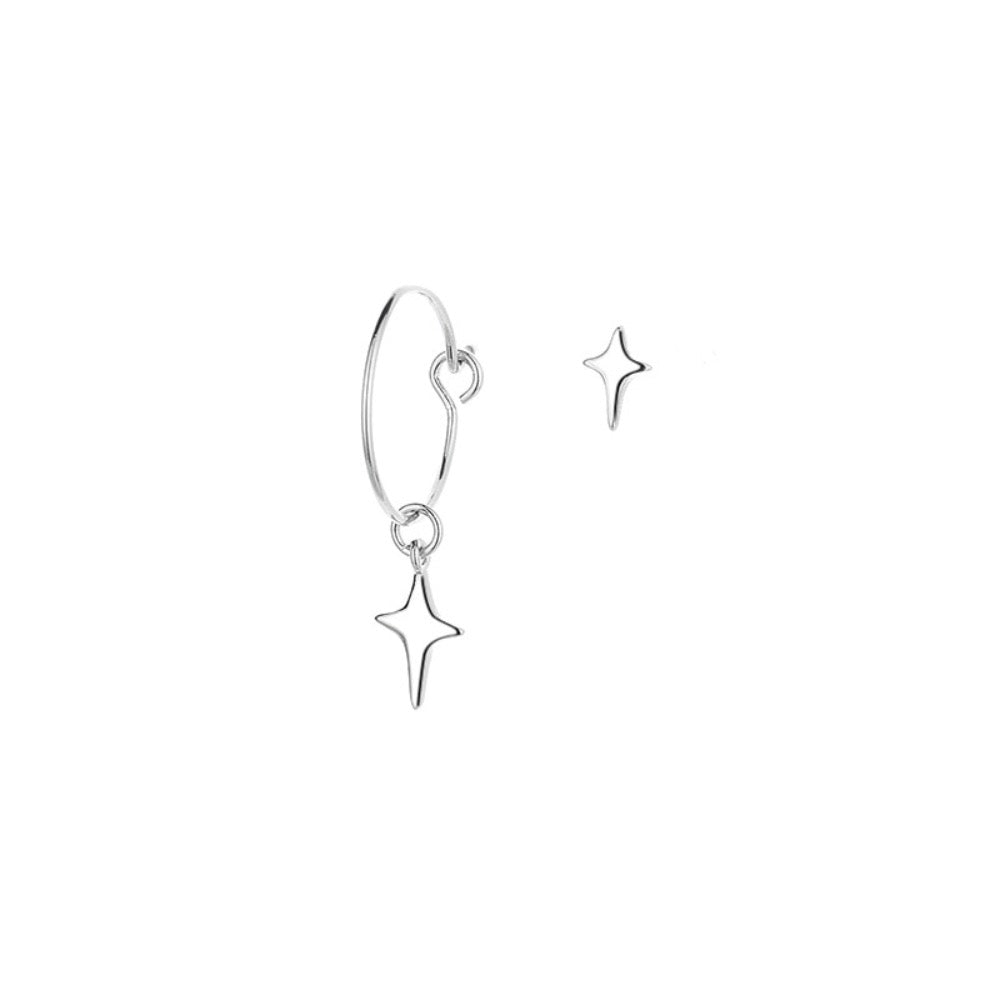 A pair of asymmetrical star earrings featuring one hoop star earring and one star stud, crafted from silver-colored copper and metal.