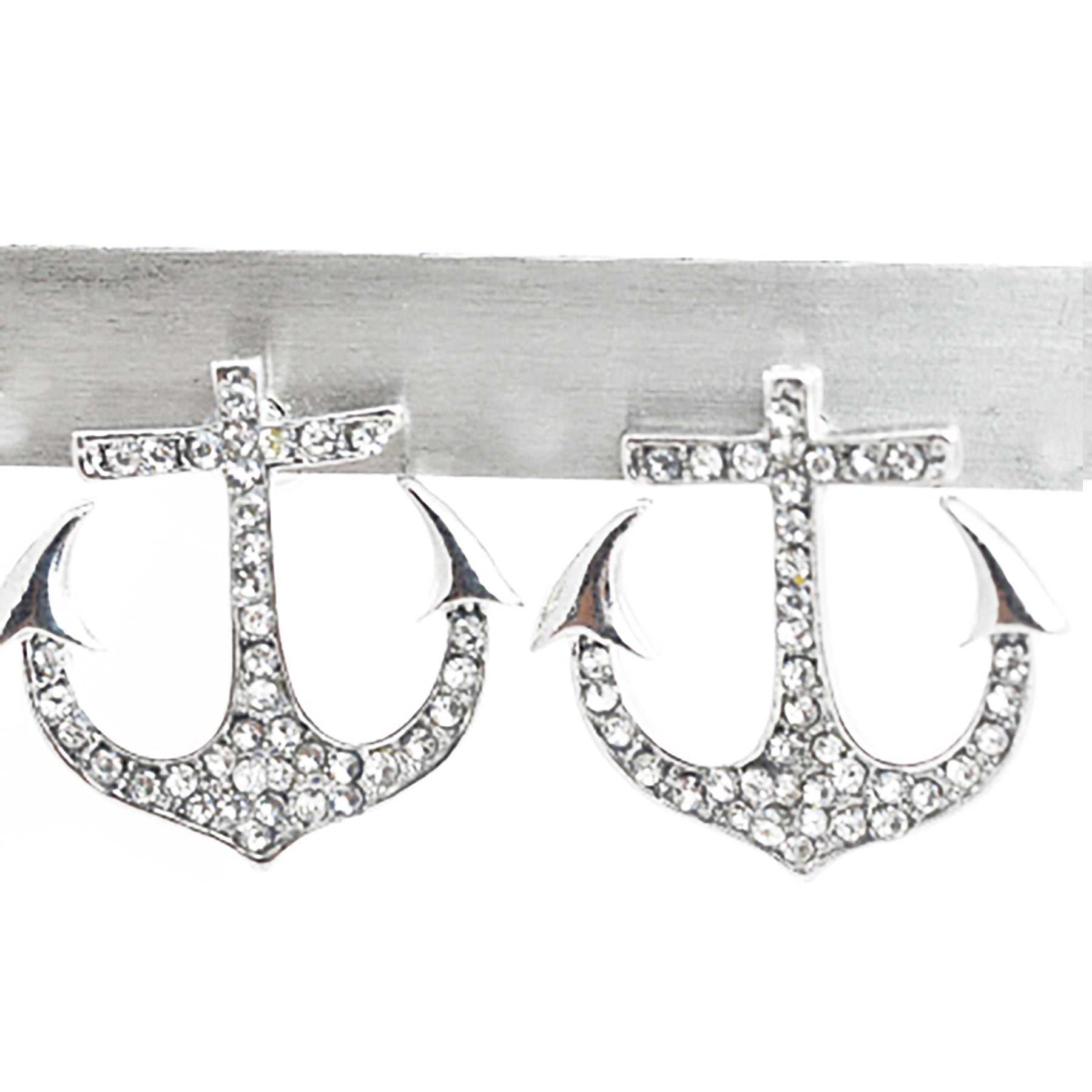 A pair of stylish studded anchor earrings with a post back, showcasing intricate detailing and a nautical theme.