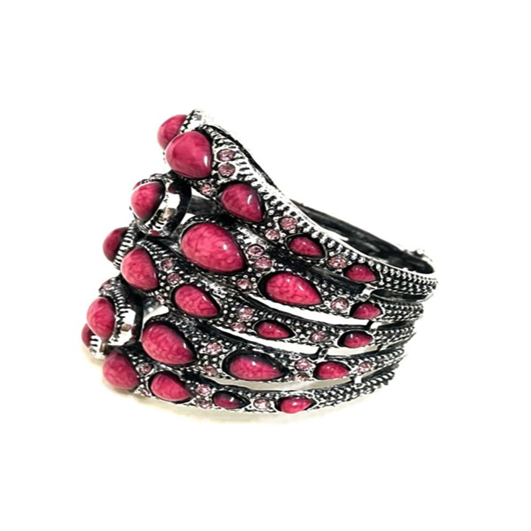 Stylish studded metal cuff bracelet with spring snap closure, showcasing a modern design perfect for any outfit.