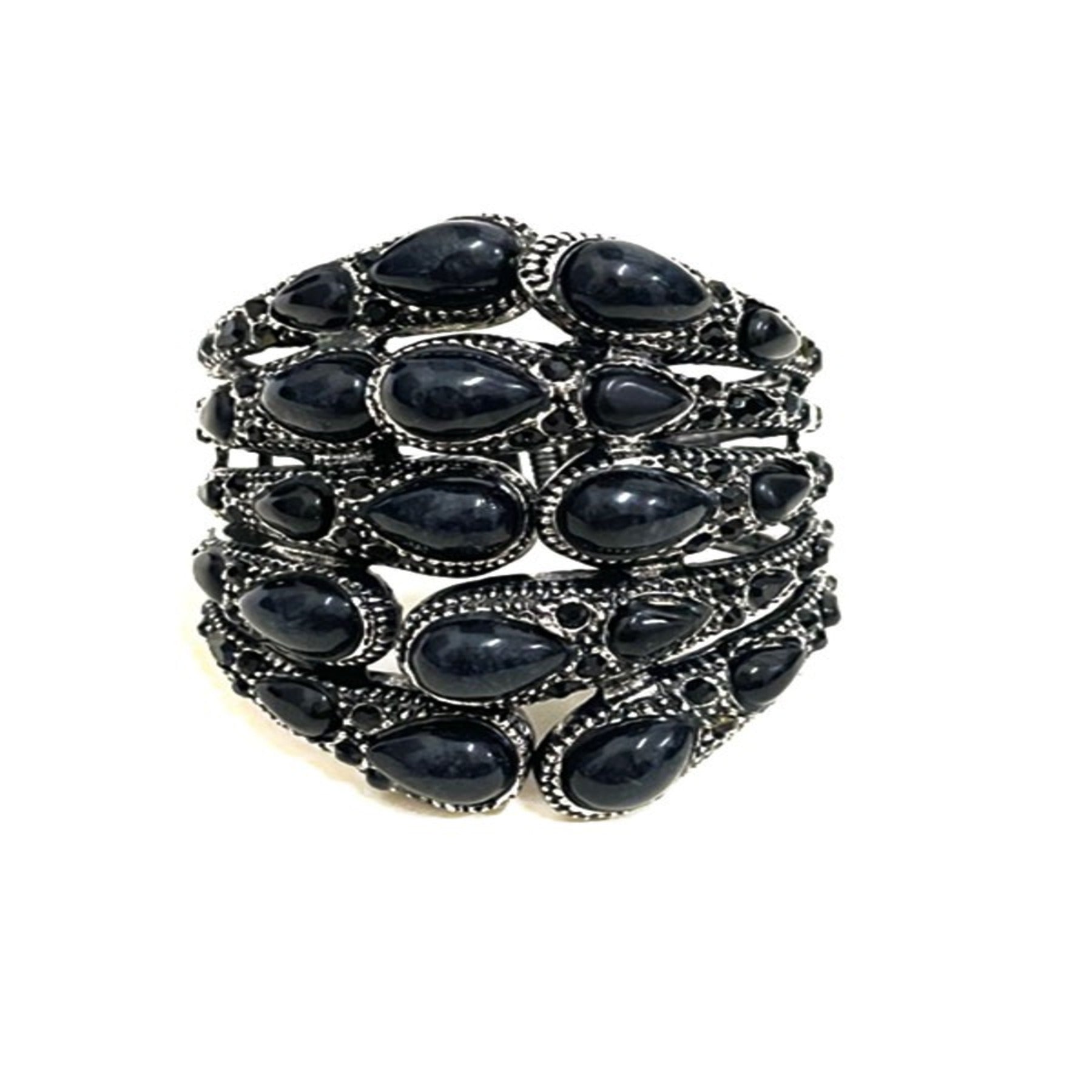 Stylish studded metal cuff bracelet with spring snap closure, showcasing a modern design perfect for any outfit.