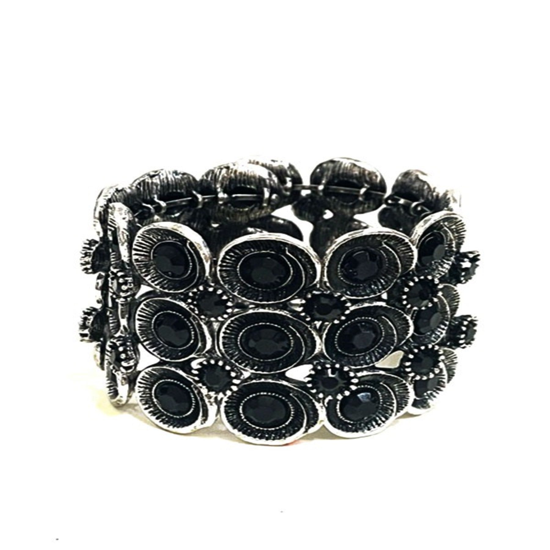 Stylish Studded Metal Cuff Bracelet with a chic design and spring wire closure, perfect for any occasion.