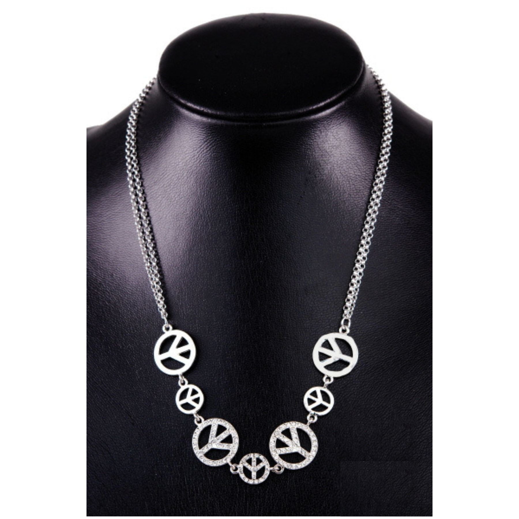 A stylish studded peace sign link necklace with double plating and an adjustable chain, showcasing a modern design.